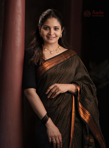 Black Kalyani cotton check saree with copper zari border